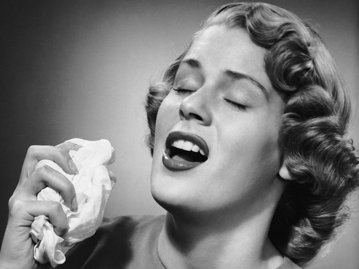 Woman sneezing