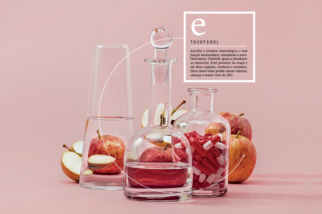 Vitamina E: tocoferol. Um vidro de comprimidos repleto de maçãs.